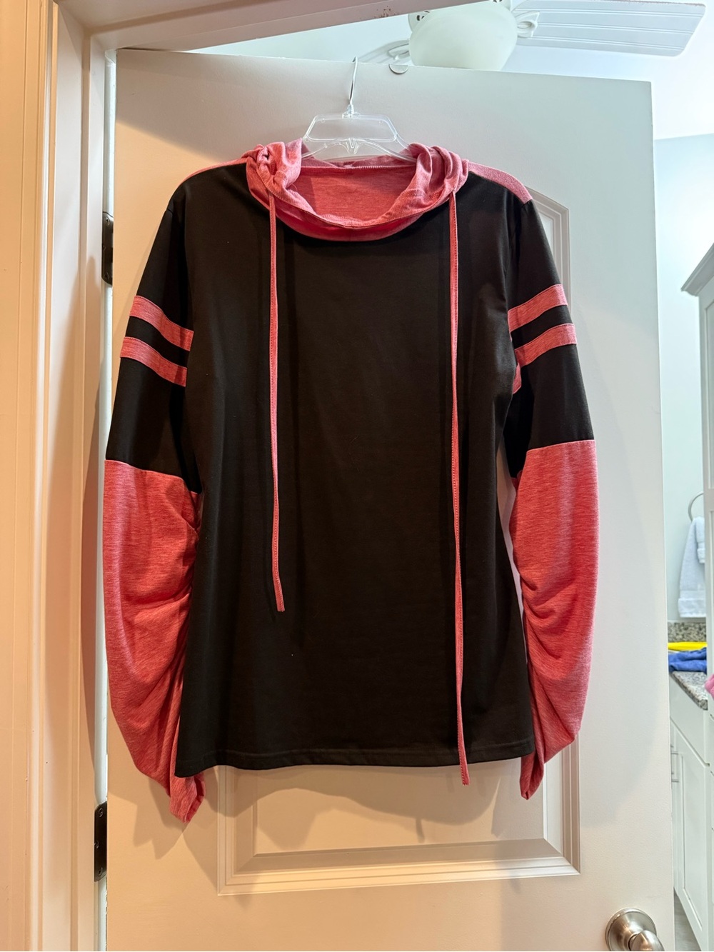 Women’s Black and Pink Hooded Pullover Shirt